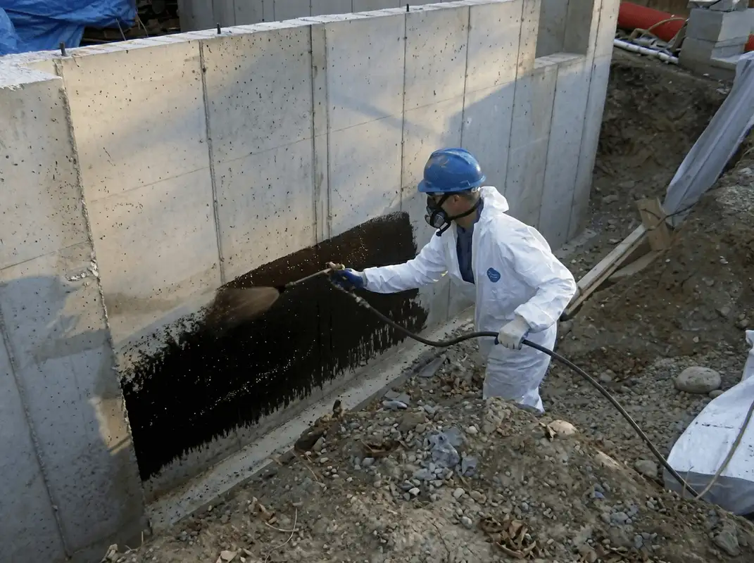 Professional waterproofing the exterior walls of the basement in New Haven, CT