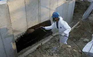 Professional waterproofing the exterior walls of the basement in New Haven, CT