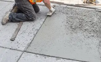 Professional repairing a concrete floor in New Haven, CT