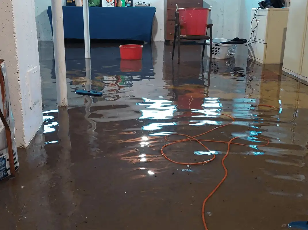 Basement with boiler, cabinets and washing machine completely flooded in New Haven, CT