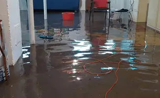 Basement with boiler, cabinets and washing machine completely flooded in New Haven, CT